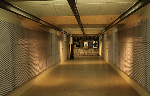 indoor gun range tunnel is soundproofed with acoustic foam panels