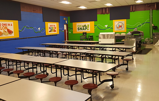 cafetria walls treated with sound panels to lower noise levels in a loud cafeteria