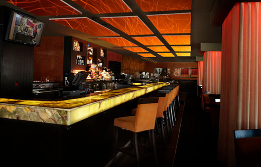 sound panels float over a bar to soundproof the room