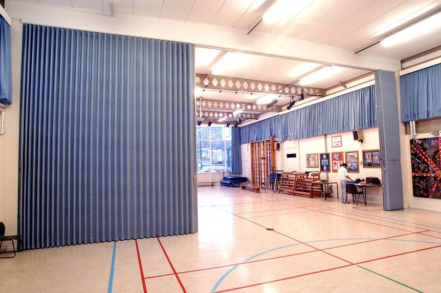 sound barrier accordion style curtain system isolates room noise