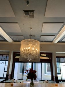 Ceiling soundproofing panels control acoustics in a restaurant